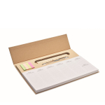 Planificador semanal con bolígrafo de tinta azul, regla y adhesivos color beige vista de impresión