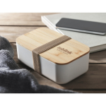 Fiambrera hecha de maíz con tapa de bambú y cierre elástico 1L color beige segunda vista bodegón principal