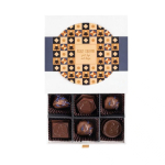 Cofre de 9 bombones de chocolate con leche con relleno café o ciruelas color blanco