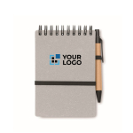 Libreta con bolígrafo de tinta azul y banda elástica hojas a rayas color gris vista de impresión