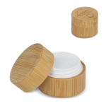 Bálsamo labial en estuche de bambú de forma cilíndrica