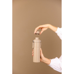 Botella térmica en acero reciclado con asa y doble apertura 600ml color marfil vista de ambiente 2