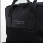 Mochila extensible under the seat de piel sintética para PC 14'' vista con logo impreso