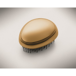Cepillo de plástico y aluminio para cabello con función desenredante color dorado vista fotografía tercera vista