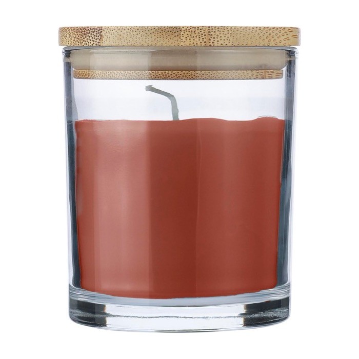 Vela con aroma a vainilla en tarro de vidrio y tapa de bambú color naranja primera vista Vela con aroma a vainilla en tarro de vidrio y tapa de bambú color naranja primera vista