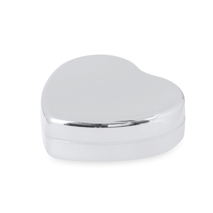 Bálsamo labial de aroma a vainilla y SPF15 en forma de corazón color plateado primera vista Bálsamo labial de aroma a vainilla y SPF15 en forma de corazón color plateado primera vista