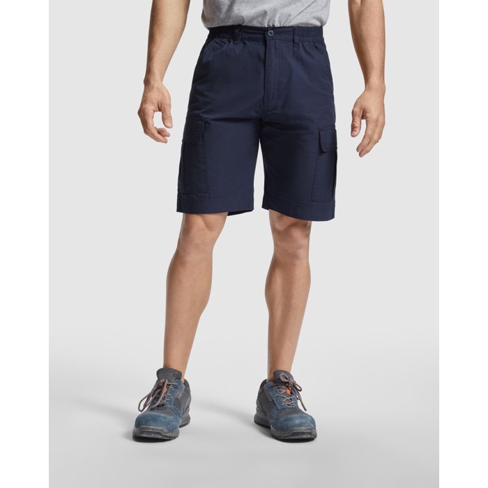 Bermuda corta con bolsillos hecha de algodón 200 g/m2 Roly Direct Amazonas color azul marino primera vista de uso Bermuda corta con bolsillos hecha de algodón 200 g/m2 Roly Direct Amazonas color azul marino primera vista de uso