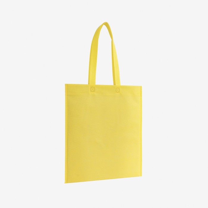 Bolsa non-woven con asas largas termoselladas y resistencia 6kg color amarillo primera vista de uso