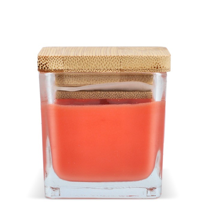 Vela de cera vegetal en tarro de cristal con tapa de bambú color naranja quinta vista Vela de cera vegetal en tarro de cristal con tapa de bambú color naranja quinta vista