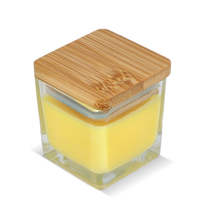Vela de cera vegetal en tarro de cristal con tapa de bambú color amarillo Vela de cera vegetal en tarro de cristal con tapa de bambú color amarillo