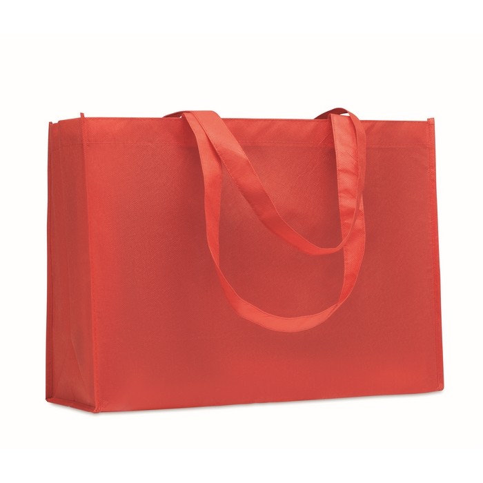 Bolsa larga unicolor de RPET no tejido con asas largas 80 g/m2 color rojo Bolsa larga unicolor de RPET no tejido con asas largas 80 g/m2 color rojo