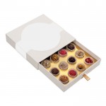 Cofre de 16 trufas decoradas rellenas de varios sabores gourmet color blanco segunda vsta