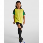 Peto deportivo unisex de poliéster transpirable 90 g/m2 Roly Direct Roma color amarillo fluorescente segunda vista de uso