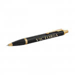 Bolígrafo bicolor con acabados dorados color negro con logo