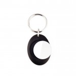 Llavero con forma ovalada que tiene moneda para carro interior vista 2