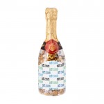 Botella de champán rellena de surtido de caramelos color transparente vista principal