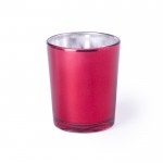 Vela aromática en recipiente de cristal color rojo