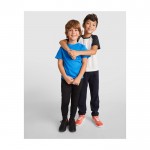 Pantalón infantil con cintura elástica de poliéster 220 g/m2 Roly color azul marino imagen de estilo de vida