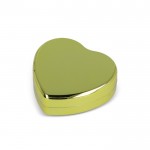 Bálsamo labial en estuche metálico en forma de corazón color dorado tercera vista