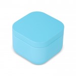 Vela de cera vegetal con aroma a vainilla en tarro de metal cuadrado color azul claro