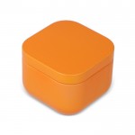 Vela de cera vegetal con aroma a vainilla en tarro de metal cuadrado color naranja