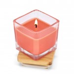 Vela de cera vegetal en tarro de cristal con tapa de bambú color naranja segunda vista