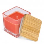 Vela de cera vegetal en tarro de cristal con tapa de bambú color naranja tercera vista