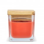 Vela de cera vegetal en tarro de cristal con tapa de bambú color naranja cuarta vista