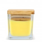 Vela de cera vegetal en tarro de cristal con tapa de bambú color amarillo cuarta vista