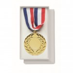 Medalla de hierro con cinta tricolor de azul, blanco y rojo color dorado