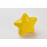 Clásica antiestrés en forma de estrella en distintos colores color amarillo vista fotografía tercera vista