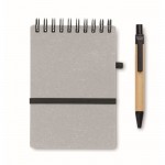 Libreta con bolígrafo de tinta azul y banda elástica hojas a rayas color gris cuarta vista