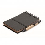 Libreta con bolígrafo de tinta azul y banda elástica hojas a rayas color gris oscuro