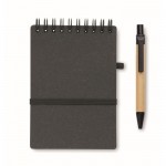 Libreta con bolígrafo de tinta azul y banda elástica hojas a rayas color gris oscuro cuarta vista