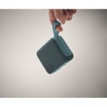 Pequeño altavoz inalámbrico con asa a juego para transporte color negro mate vista fotografía tercera vista
