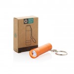 Llavero linterna de aluminio reciclado con LED y 15 lúmenes color naranja vista con caja