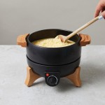 Fondue eléctrica con control preciso y capacidad para 8 personas Boska color negro vista de ambiente
