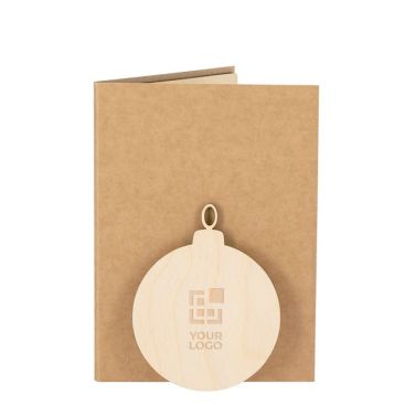 Postal navideña con adorno en forma de bola y semillas de pino