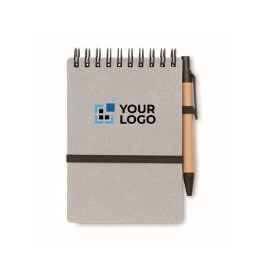 Libreta con bolígrafo de tinta azul y banda elástica hojas a rayas